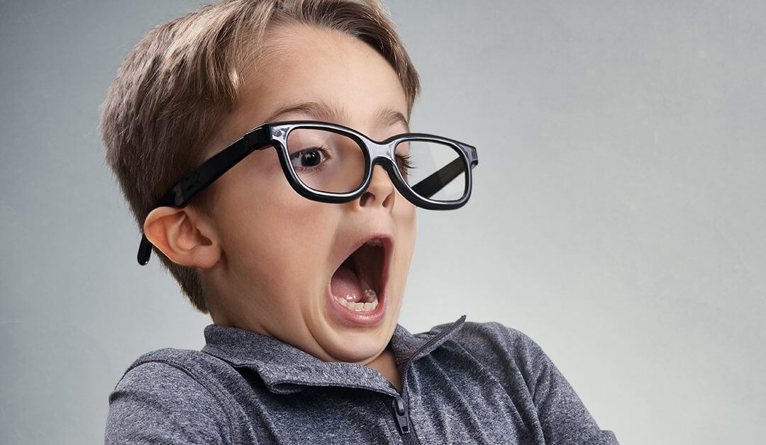 shocked boy dressed like a businessman